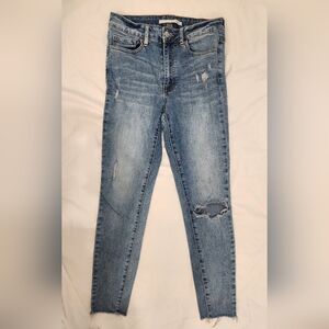 Blue Skinny Jeans with Distressed Knee and Faded Wash
